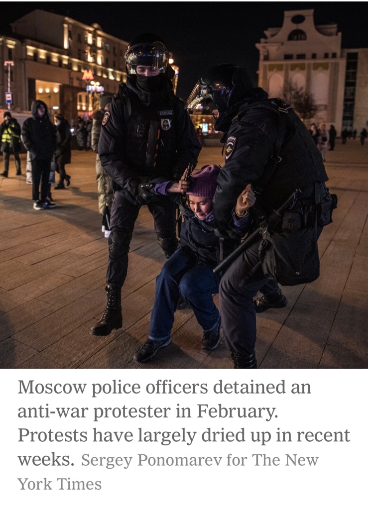 Moscow police officers detained an anti-war protester in February. Protests have largely dried up in recent weeks.